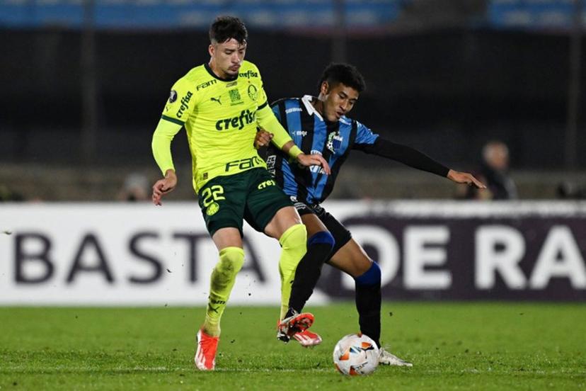 Palmeiras' Uruguayan defender Joaquin Piquerez (L) and Liverpool's defender Kevin Johan Amaro fight for the ball during the Copa Libertadores group stage second leg football match between Uruguay's Liverpool and Brazil's Palmeiras, at the Centenario stadium in Montevideo, on May 9, 2024. Eitan ABRAMOVICH / AFP