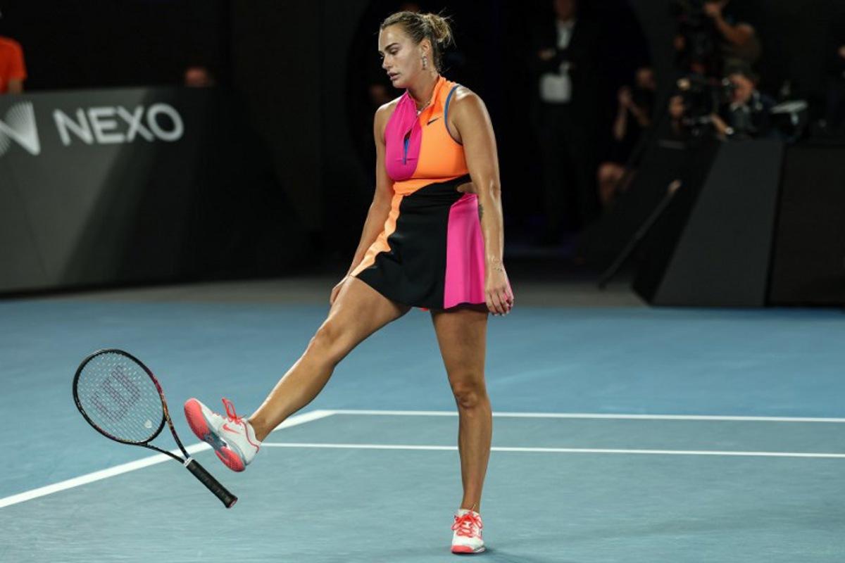 Belarus' Aryna Sabalenka throws her racquet after a point against Kazakhstan's Elena Rybakina during their women's singles final match on day fourteen of the Australian Open tennis tournament in Melbourne on January 31, 2026. IZHAR KHAN / AFP