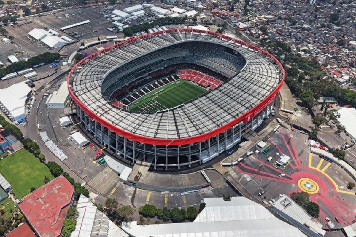 This aerial view shows the Mexico City Stadium, renamed from Azteca Stadium (or Banorte Stadium) for the FIFA World Cup, in Mexico City on May 28, 2026. FIFA temporarily branded the iconic Azteca Stadium as "Mexico City Stadium" for the 2026 World Cup, enforcing a strict "debranding" policy that requires all host stadiums to remove or cover non-official corporate sponsor names, suite branding, and external logos. Carl DE SOUZA / AFP