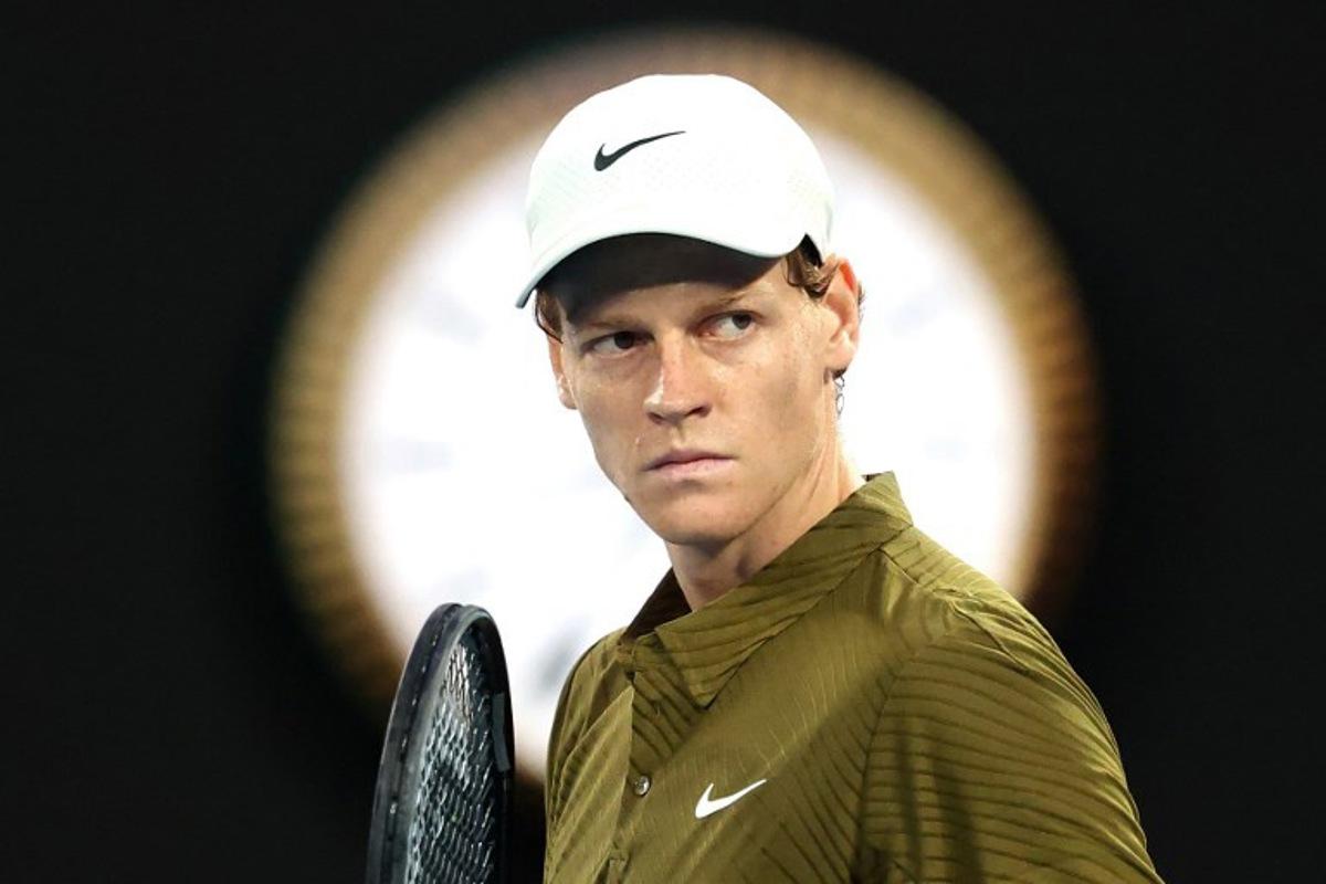 Italy's Jannik Sinner reacts on a point to USA's Ben Shelton during their men's singles quarter-final match on day eleven of the Australian Open tennis tournament in Melbourne on January 28, 2026. DAVID GRAY / AFP