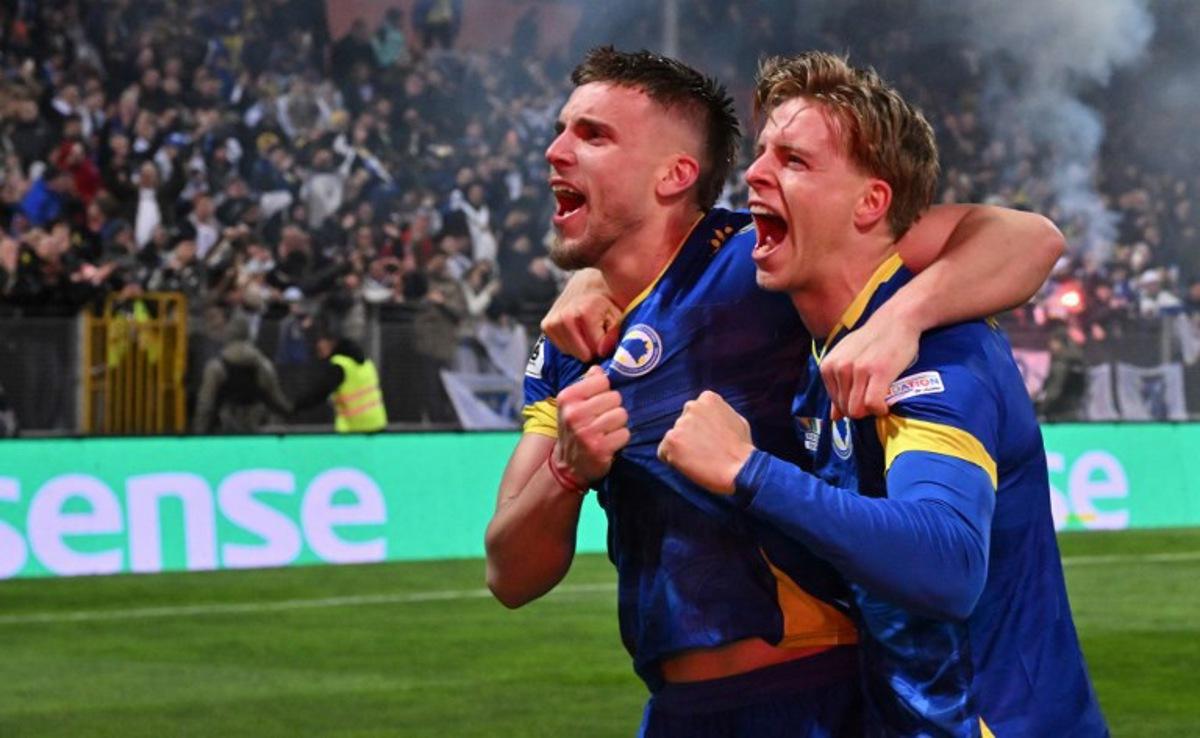 Bosnia-Herzegovina's forward #10 Ermedin Demirovic (L) and Bosnia-Herzegovina's midfielder #17 Dzenis Burnic celebrate qualifying for the FIFA World Cup 2026 after Bosnia-Herzegovina won their European qualification final football match against Italy at the Bilino-Polje stadium in Zenica on March 31, 2026. ELVIS BARUKCIC / AFP