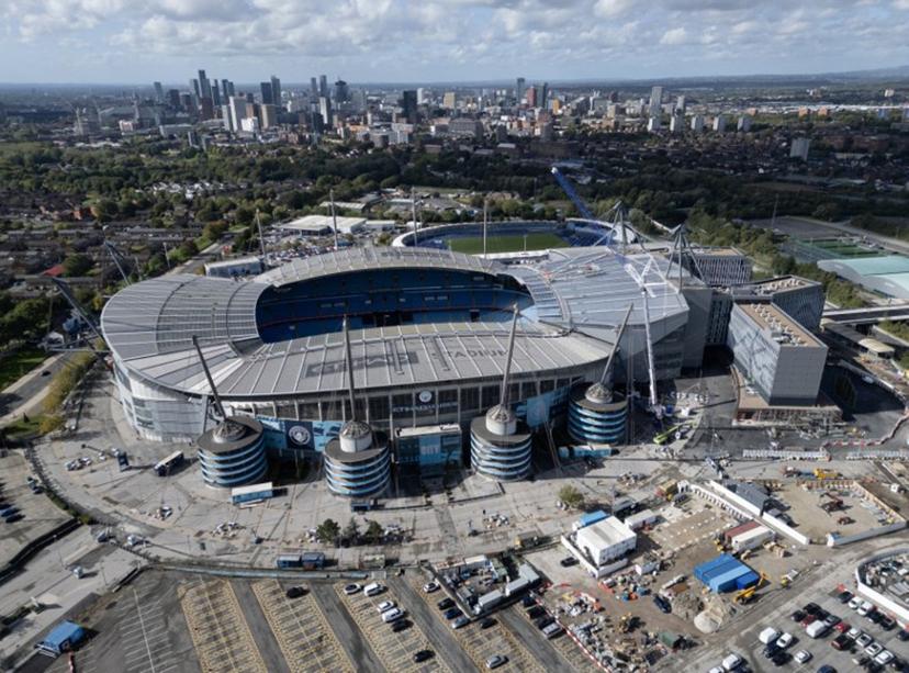 An aerial view shows The Etihad Stadium, the home ground of Manchester City football club, in Manchester, north-west England on September 30, 2026. The Premier League said on September 29 that Manchester City have been found guilty of serious breaches of the Premier League's financial rules over a nine-season period between 2009 and 2018. Oli SCARFF / AFP