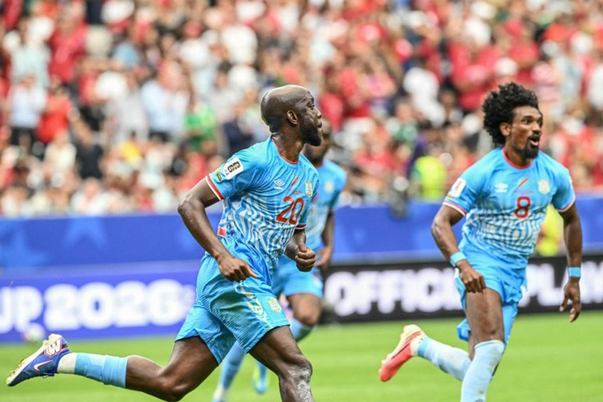 Congo DR's forward #20 Yoane Wissa (L) celebrates after scoring his team's first goal during the 2026 World Cup Group K football match between Portugal and the Democratic Republic of Congo at the Houston Stadium in Houston on June 17, 2026. RONALDO SCHEMIDT / AFP