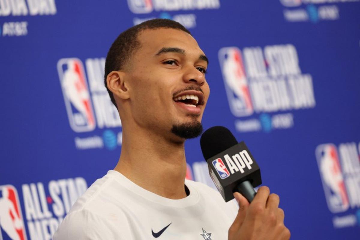 French basketball player Victor Wembanyama of the San Antonio Spurs speaks to the media during the NBA All-Star media day at the Intuit Dome in Inglewood, California, on February 14, 2026. Patrick T. Fallon / AFP
