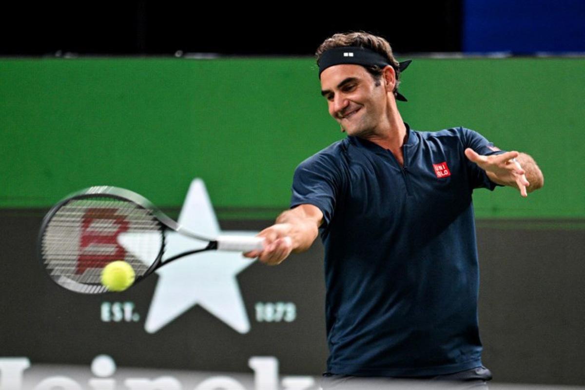 Swiss Roger Federer participates in the exhibition event Roger and friends celebrity doubles match at the Shanghai Masters tennis tournament in Shanghai on October 10, 2025. Hector RETAMAL / AFP