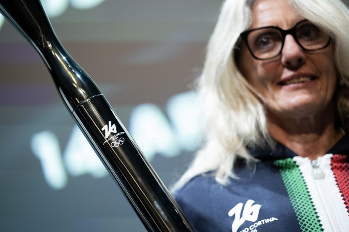 Former cross-country Italian athlete Stefania Belmondo poses during the unveiling of the torches for the Milano Cortina 2026 winter olympic and paralympic games in Milan on April 14, 2025. MARCO BERTORELLO / AFP