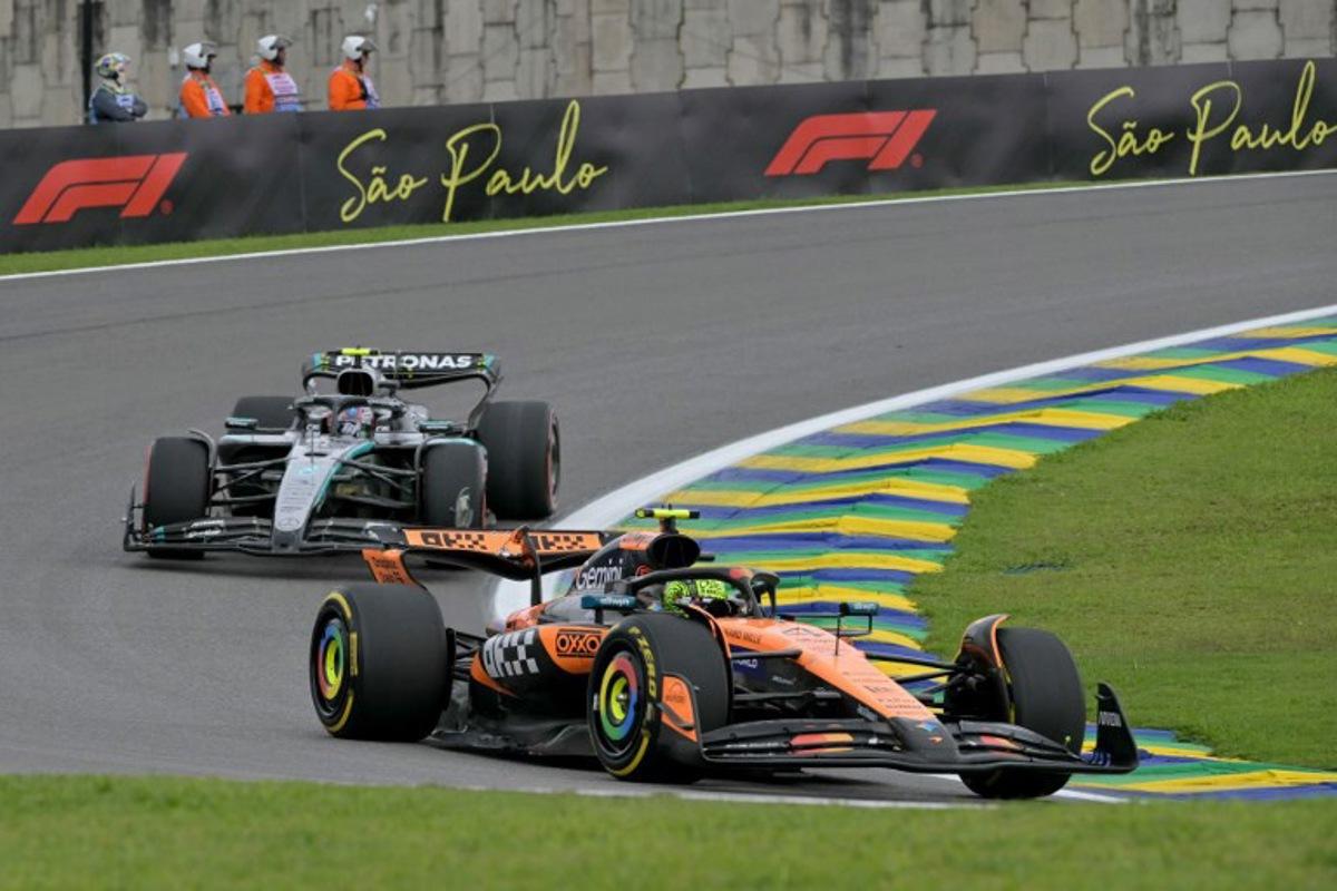 McLaren's British driver Lando Norris (R) races ahead of Mercedes' Italian driver Kimi Antonelli (L) during the sprint of the Sao Paulo Formula One Grand Prix at the Jose Carlos Pace racetrack, aka Interlagos, in Sao Paulo, Brazil on November 8, 2025. Nelson ALMEIDA / AFP