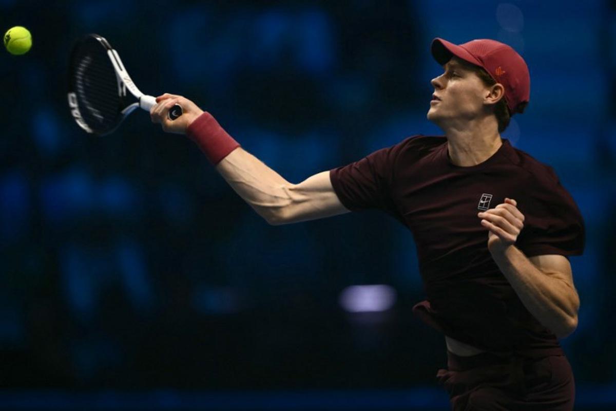 Italy's Jannik Sinner hits the ball during his match against Canada's Felix Auger-Aliassime at the ATP Finals tennis tournament in Turin on November 10, 2025. Marco BERTORELLO / AFP
