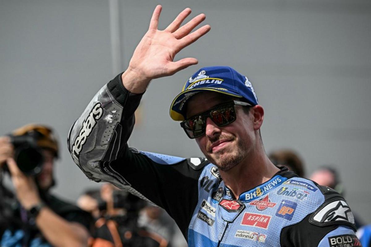 BK8 Gresini Racing MotoGP team's Spanish MotoGP rider Alex Marquez waves after coming second place in the Sprint race in the MotoGP Malaysian Grand Prix at the Sepang International Circuit in Sepang on October 25, 2025. Lillian SUWANRUMPHA / AFP
