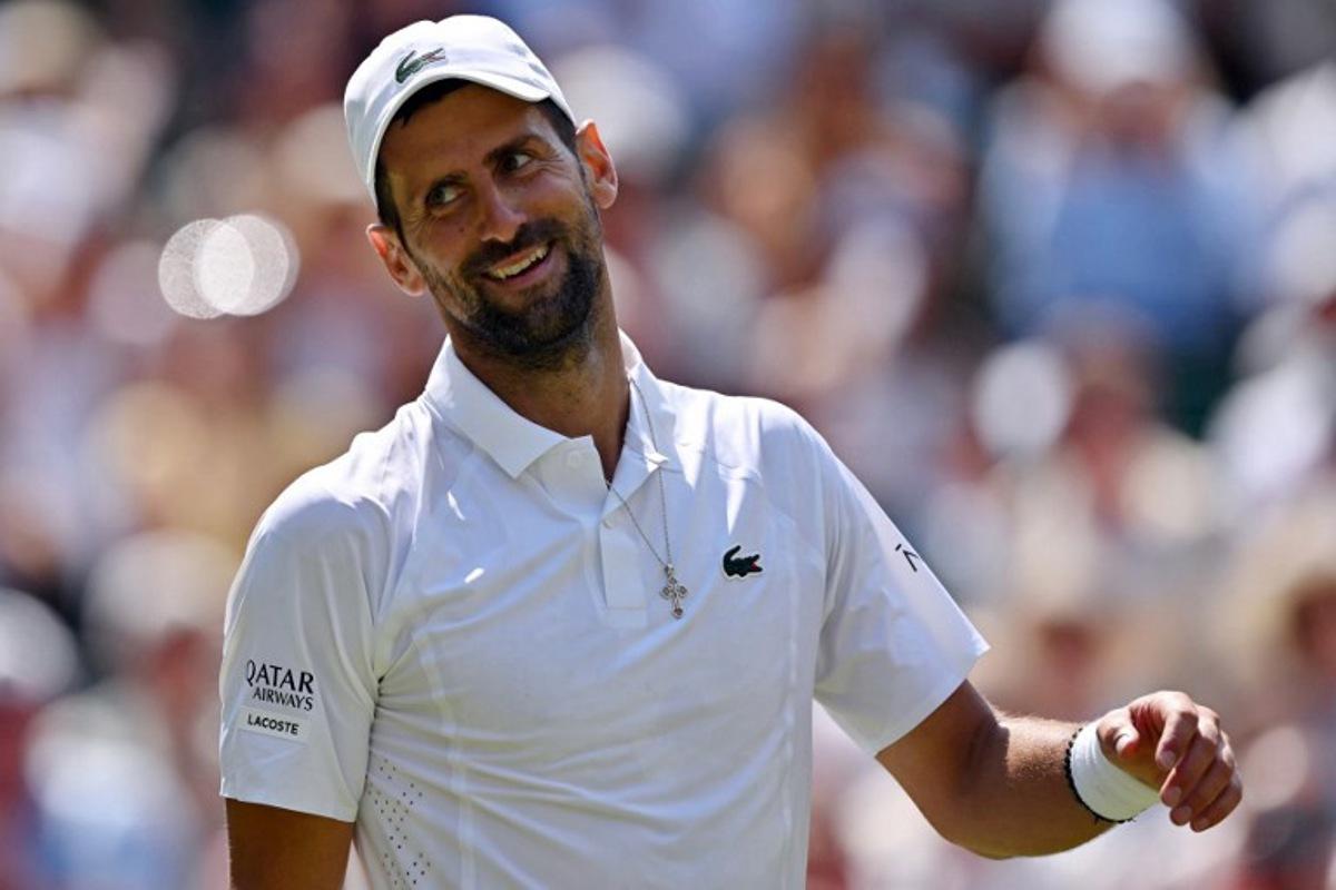 Serbia's Novak Djokovic smiles as he plays against France's Arthur Rinderknech during their men's singles third round tennis match on the fifth day of the 2026 Wimbledon Championships at The All England Lawn Tennis and Croquet Club in Wimbledon, southwest London, on July 3, 2026. Glyn KIRK / AFP
