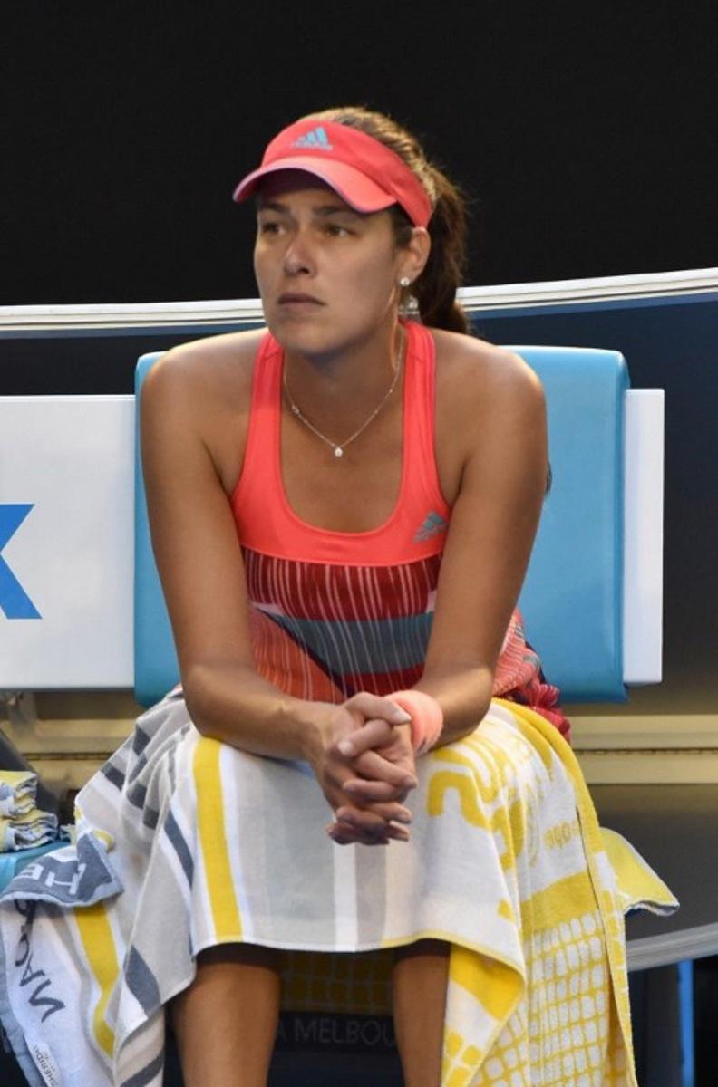 Serbia's Ana Ivanovic looks on after her match against Madison Keys of the US was suspended following a medical emergency with Ivanovic's coach Nigel Sears on day six of the 2015 Australian Open tennis tournament in Melbourne on January 23, 2016. AFP PHOTO / SAEED KHAN-- IMAGE RESTRICTED TO EDITORIAL USE - STRICTLY NO COMMERCIAL USE SAEED KHAN / AFP