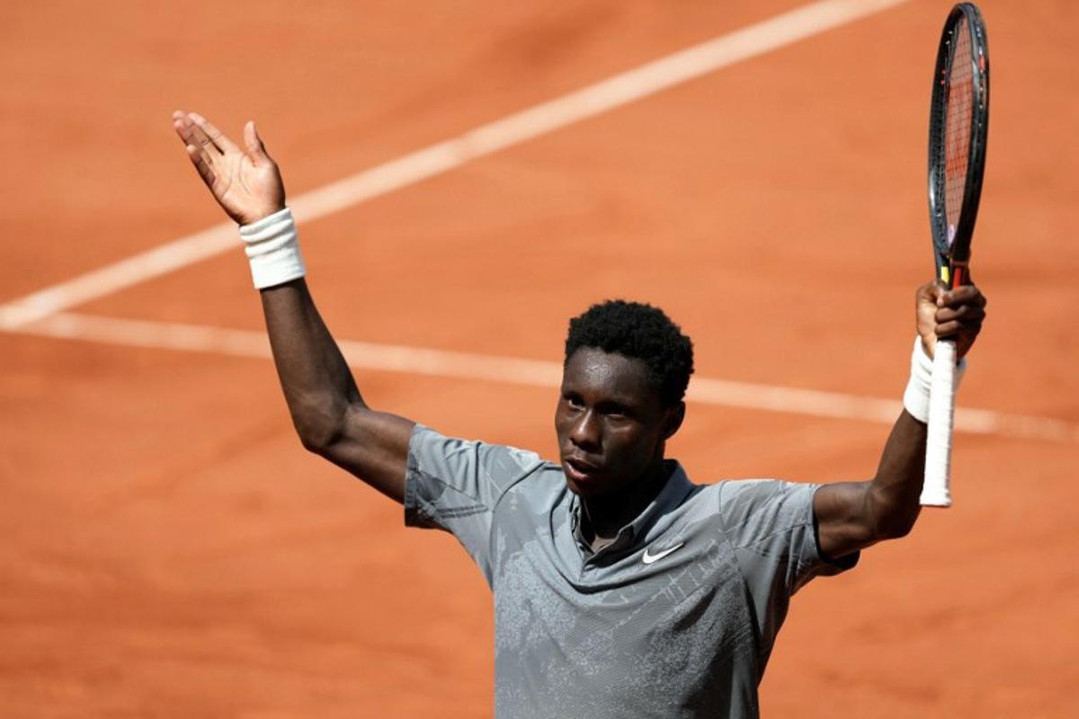 France's Moise Kouame reacts after winning a game as he plays against Paraguay's Adolfo Daniel Vallejo during their men's singles match on day 5 of the French Open tennis tournament on Court Suzanne-Lenglen at the Roland-Garros Complex in Paris on May 28, 2026. Dimitar DILKOFF / AFP