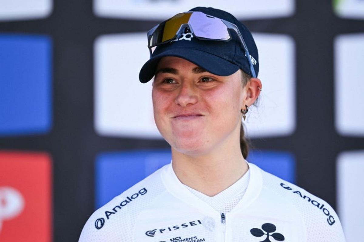 Third-placed UAE Team ADQ's Spanish Paula Blasi celebrates on the podium after 'La Fleche Wallonne' one day cycling race, 141 km from Huy to Huy, on April 22, 2026. JOHN THYS / AFP