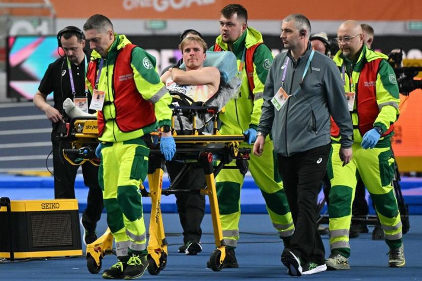 Belgium's Simon Verherstraeten is carried on a stretcher after the men's final 60 metres event during the World Athletics Indoor Championships Kujawy Pomorze 2026 in Torun, Poland on March 20, 2026. Andrej ISAKOVIC / AFP