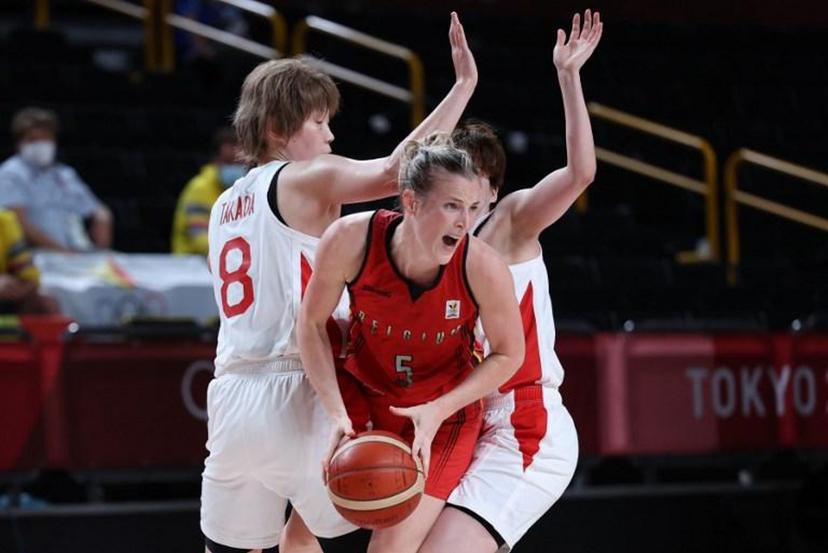 Belgium's Kim Mestdagh fights for the ball with Japan's Maki Takada (L) and Japan's Saki Hayashi (R) in the women's quarter-final basketball match between Japan and Belgium during the Tokyo 2020 Olympic Games at the Saitama Super Arena in Saitama on August 4, 2021. Thomas COEX / AFP