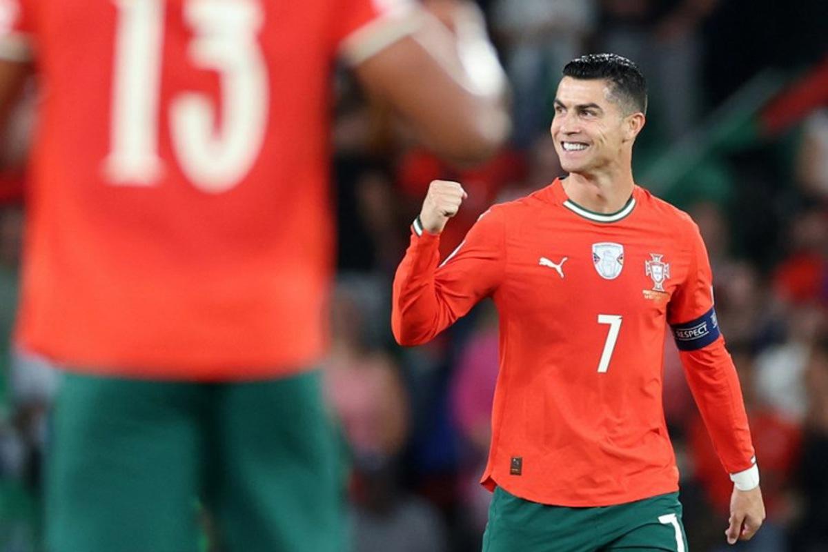 Portugal's forward #16 Cristiano Ronaldo celebrates after scoring the equalising goal during the 2026 World Cup qualifiers Europe zone group F football match between Portugal and Hungary at Jose Alvalade stadium in Lisbon on October 14, 2025. PATRICIA DE MELO MOREIRA / AFP