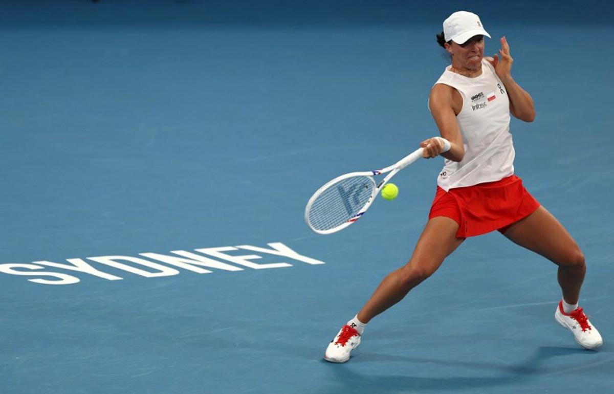 Poland's Iga Swiatek hits a return to Australia's Maya Joint during their women's singles quarter-final match at the United Cup at Ken Rosewall Arena in Sydney on January 9, 2026. Izhar Khan / AFP