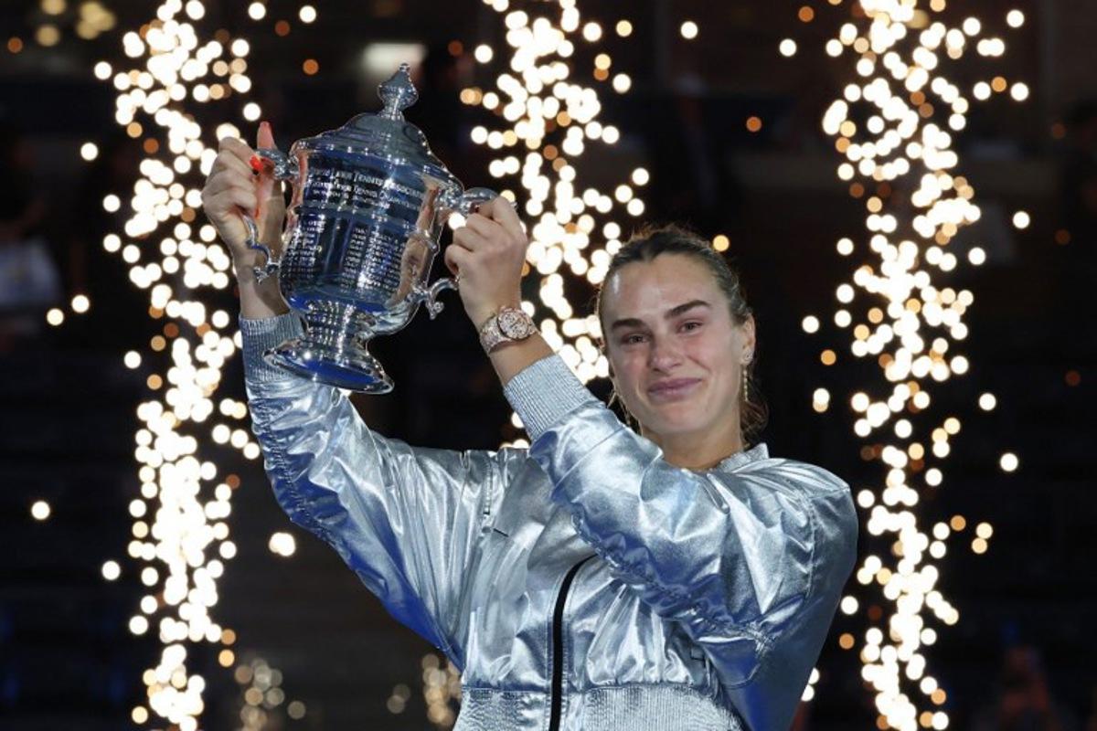 Belarus's Aryna Sabalenka poses with the trophy after defeating USA's Amanda Anisimova during their women's singles final tennis match on day fourteen of the US Open tennis tournament at the USTA Billie Jean King National Tennis Center in New York City, on September 6, 2025. TIMOTHY A.CLARY / AFP
