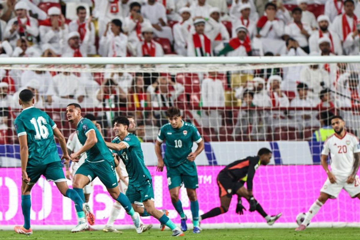 Iraq's midfielder #16 Amir Al-Ammari (2nd-L) celebrates scoring his team's first goal during the FIFA World Cup 2026 Asian qualifier football match between the United Arab Emirates and Iraq at the Mohammed bin Zayed Stadium in Abu Dhabi on November 13, 2025. Fadel SENNA / AFP