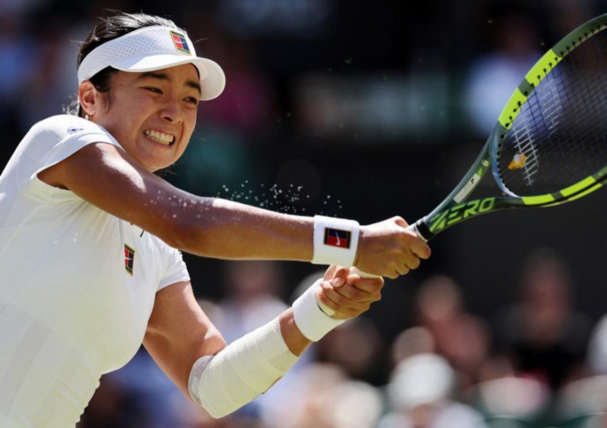 Philippines' Alexandra Eala returns to Italy's Jasmine Paolini during their women's singles round of 16 tennis match on the eighth day of the 2026 Wimbledon Championships at The All England Lawn Tennis and Croquet Club in Wimbledon, southwest London, on July 6, 2026. Adrian Dennis / AFP