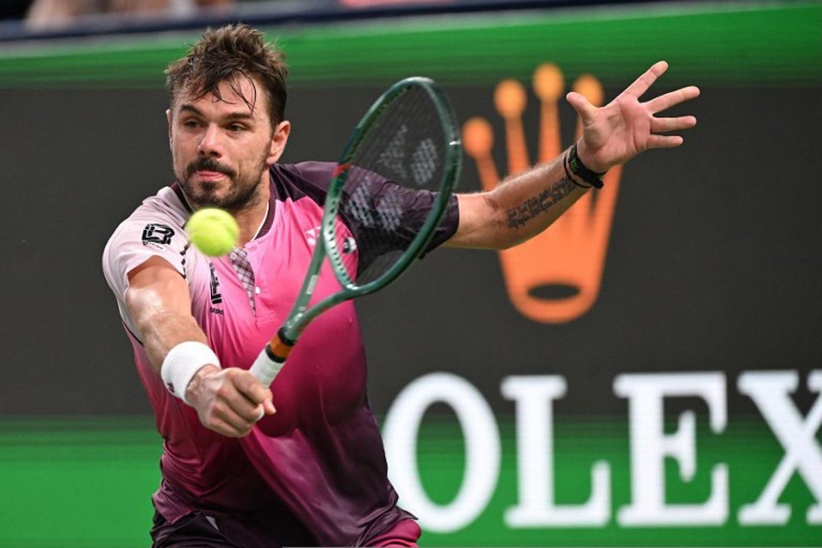 Switzerland's Stan Wawrinka hits a return to Hungary's Fabian Marozsan in their men's singles match at the Shanghai Masters tennis tournament in Shanghai on October 1, 2025. Jade Gao / AFP