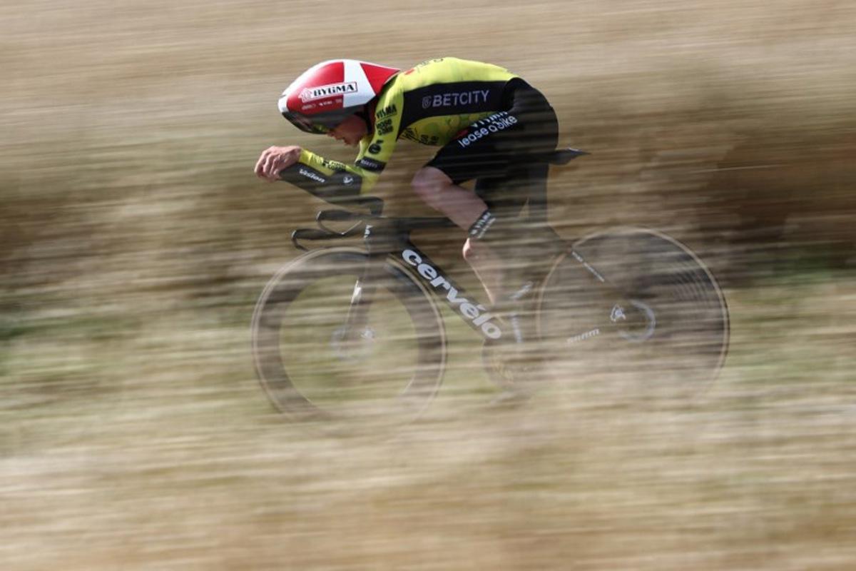 Team Visma | Lease a Bike's Danish rider Jonas Vingegaard cycles during the 4th stage of the 77th edition of the Criterium du Dauphine cycling race, a 17,4 km individual time trial between Charmes-sur-Rhône and Saint-Péray, on June 11, 2025. Anne-Christine POUJOULAT / AFP