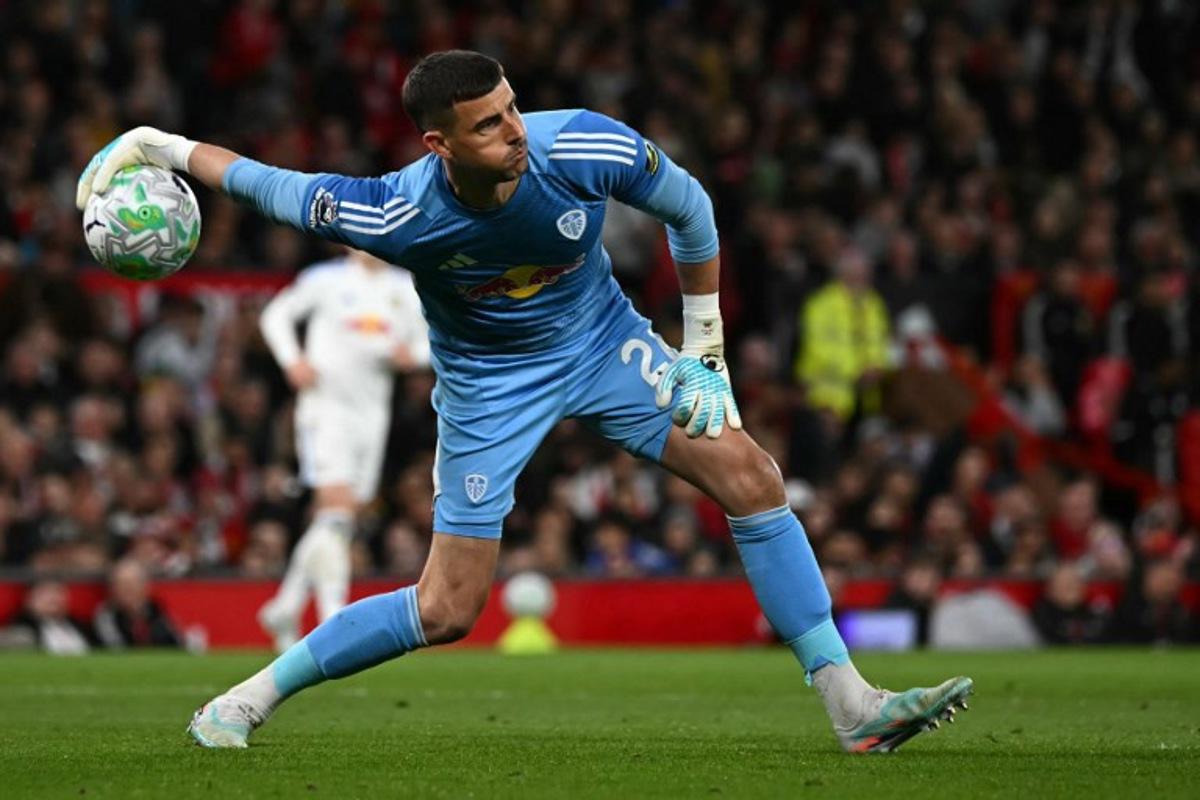 Leeds United's English goalkeeper #26 Karl Darlow throws the ball out during the English Premier League football match between Manchester United and Leeds United at Old Trafford in Manchester, north west England, on April 13, 2026. Paul ELLIS / AFP