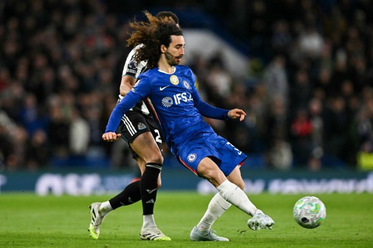 Chelsea's Spanish defender #03 Marc Cucurella passes the ball during the English Premier League football match between Chelsea and Newcastle United at Stamford Bridge in London on March 14, 2026. Glyn KIRK / AFP