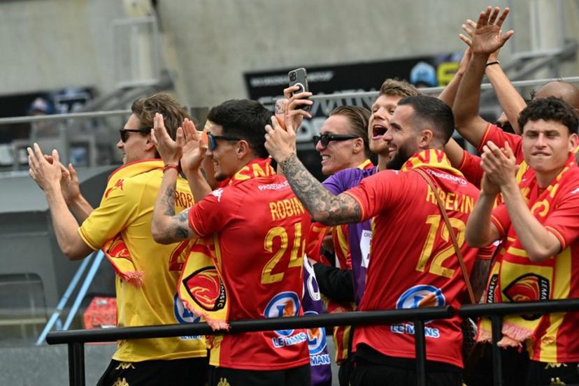 French Ligue 2 football team Le Mans' players applaud the riders during the Moto2 race as part of the Moto GP Grand Prix of France weekend at Le Mans, northwestern France, on May 10, 2026. Loic VENANCE / AFP