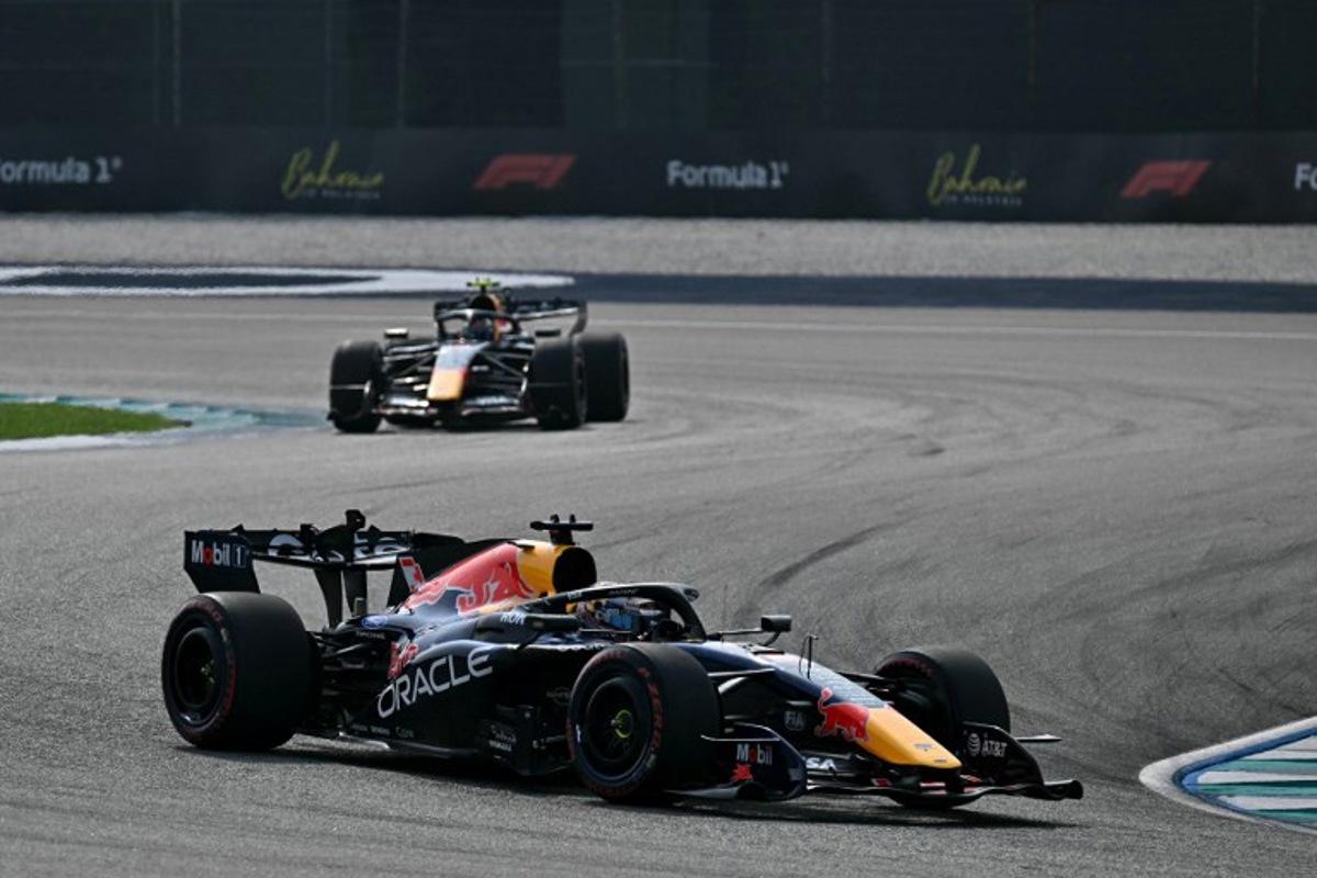 Red Bull Racing's Dutch driver Max Verstappen (front) and Red Bull Racing's French driver Isack Hadjar drive during the qualifying session of the Formula One Bahrain Grand Prix in Sepang on October 3, 2026. Lillian SUWANRUMPHA / AFP