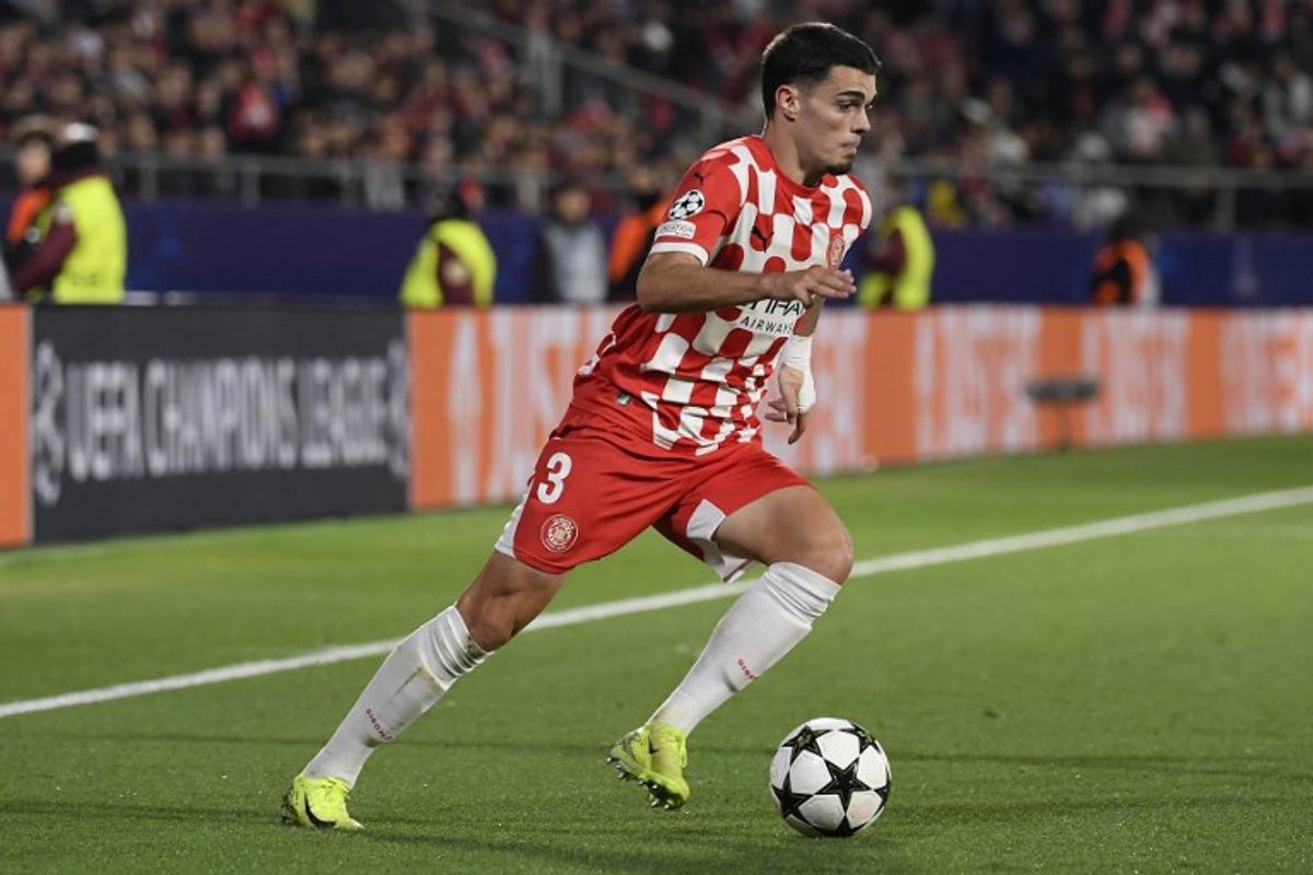 Girona's Spanish defender #03 Miguel Gutierrez controls the ball during the UEFA Champions League, league phase football match between Girona FC and Liverpool FC at the Montilivi stadium in Girona on December 10, 2024. Josep LAGO / AFP