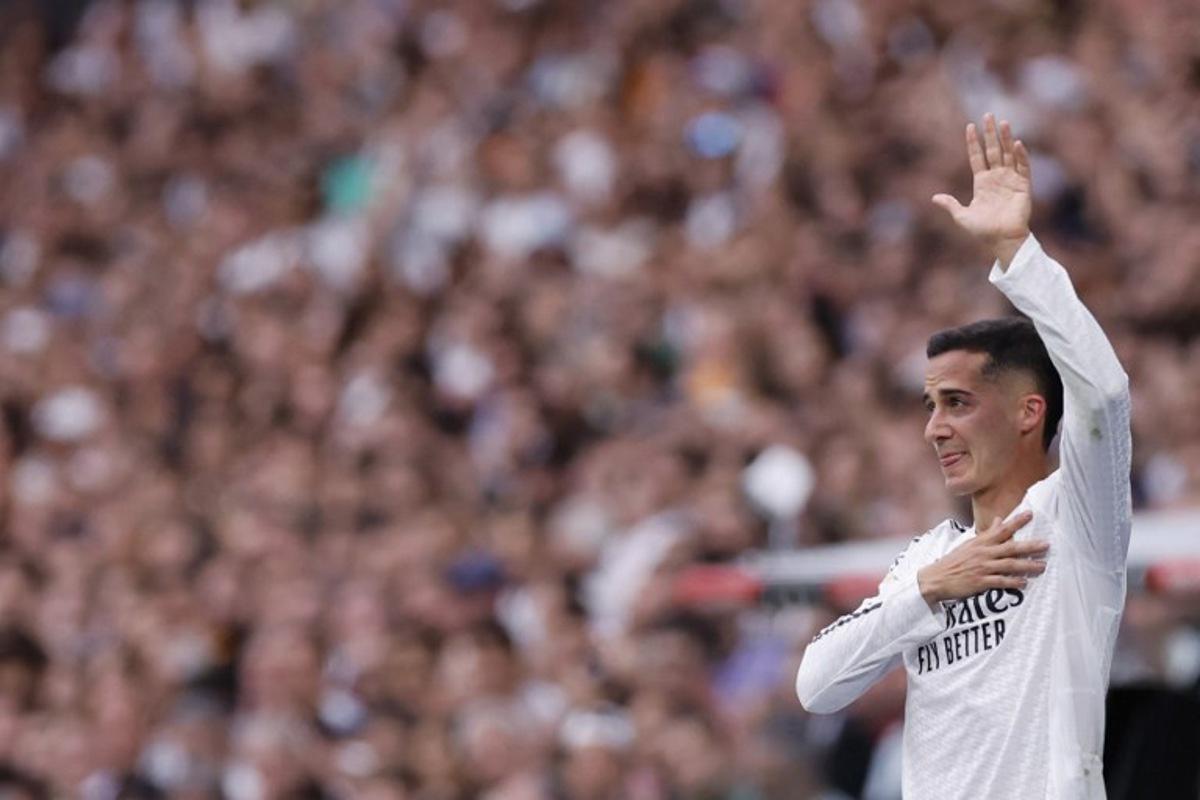 Real Madrid's Spanish defender #17 Lucas Vazquez acknowledges fans as he leaves the pitch for substitution during the Spanish league football match between Real Madrid CF and Real Sociedad at Santiago Bernabeu Stadium in Madrid on May 24, 2025. OSCAR DEL POZO / AFP
