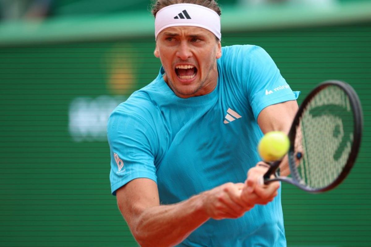 Germany's Alexander Zverev plays a backhand return to Chile's Cristian Garin during the Monte Carlo ATP Masters Series Tournament round of 32 tennis match on Court Rainier III at the Monte-Carlo Country Club in Roquebrune-Cap-Martin, south-eastern France on April 8, 2026. Valery HACHE / AFP