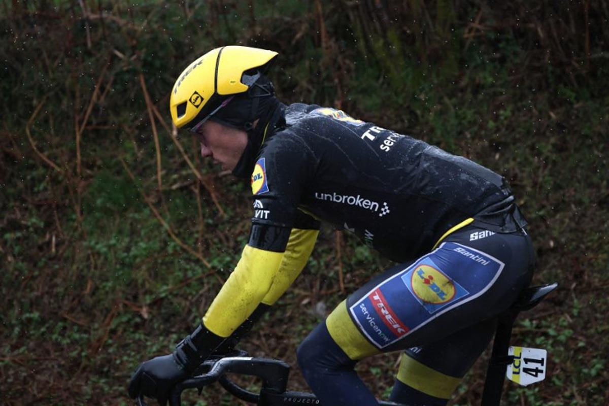 Lidl - Trek's Spanish rider Juan Ayuso, wearing the overall leader yellow jersey, cycles with the leading pack during the 4th stage of the Paris-Nice cycling race, 195 km between Bourges and Uchon, on March 11, 2026. Anne-Christine POUJOULAT / AFP