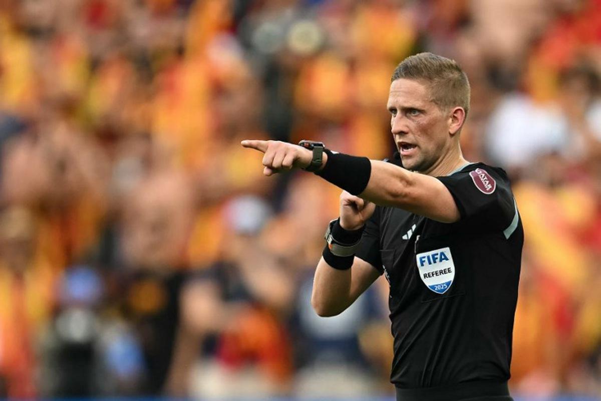 Norwegian referee Espen Eskas gestures during the FIFA Club World Cup 2025 Group D football match between US Los Angeles FC and Tunis' Esperance Sportive de Tunis at the Geodis Park stadium in Nashville on June 20, 2025. Paul ELLIS / AFP