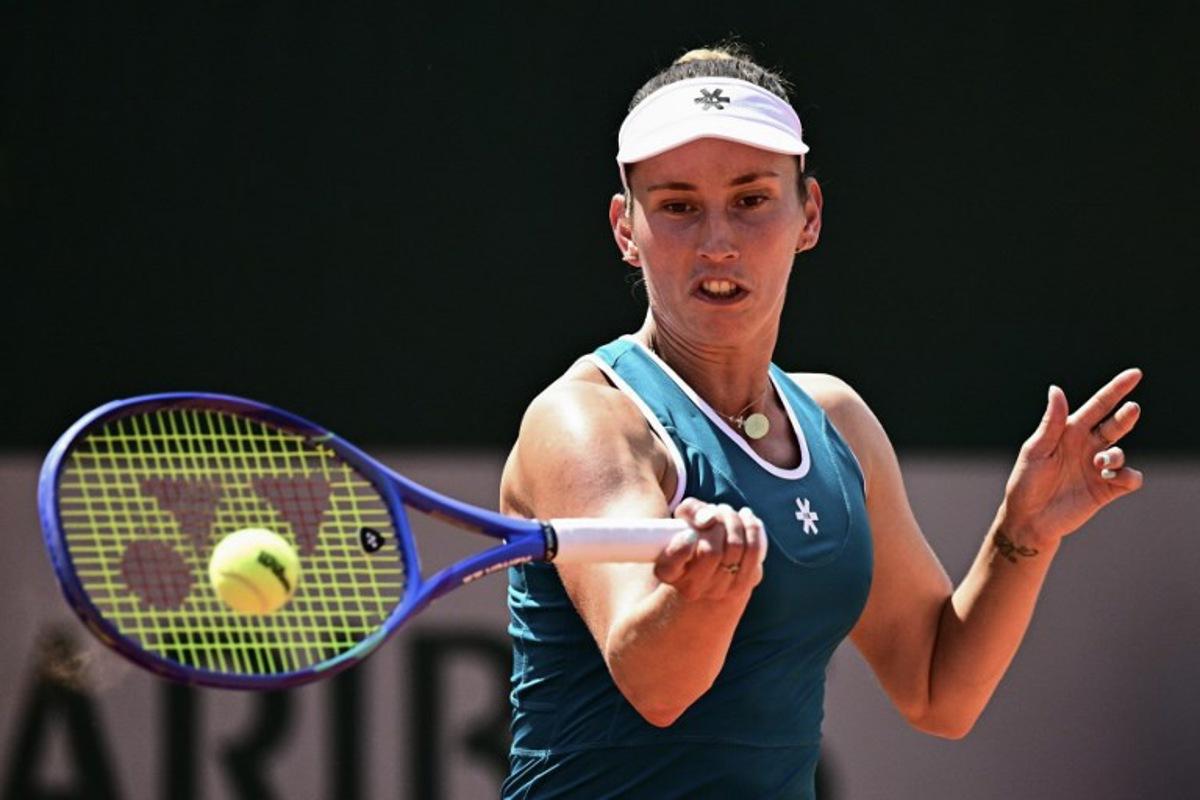 Belgium's Elise Mertens plays a forehand return to Poland's Maja Chwalinska during their women's singles match on day 5 of the French Open tennis tournament at the Roland-Garros Complex in Paris on May 28, 2026. JULIEN DE ROSA / AFP
