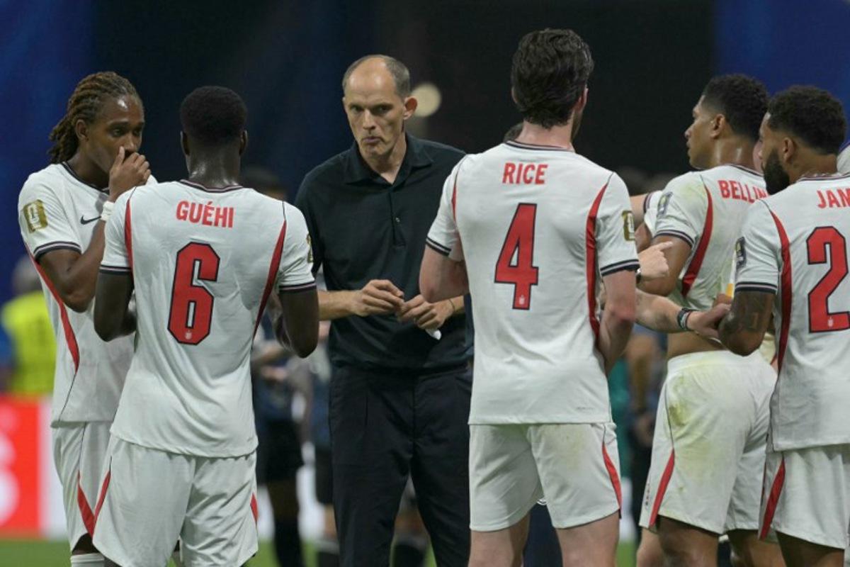 England's German head coach Thomas Tuchel (C) instructs his players in the hydration break during the 2026 World Cup football tournament semi-final match between England and Argentina at the Atlanta Stadium in Atlanta on July 15, 2026. JUAN MABROMATA / AFP