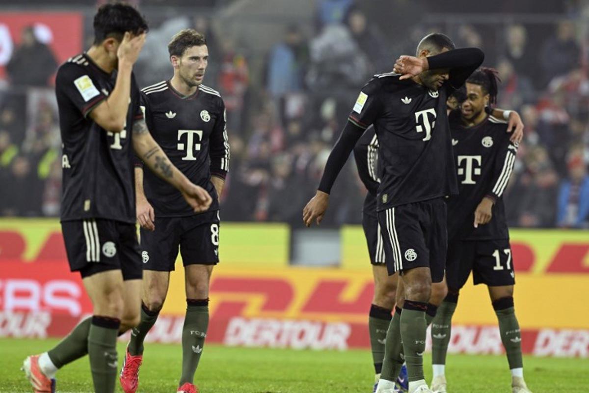 (L-R) Bayern Munich's South Korean defender #03 Kim Min-Jae, Bayern Munich's German midfielder #08 Leon Goretzka, Bayern Munich's German defender #04 Jonathan Tah and Bayern Munich's French midfielder #17 Michael Olise react during the German first division Bundesliga football match between FC Cologne and FC Bayern Munich in Cologne, western Germany on January 14, 2026. INA FASSBENDER / AFP