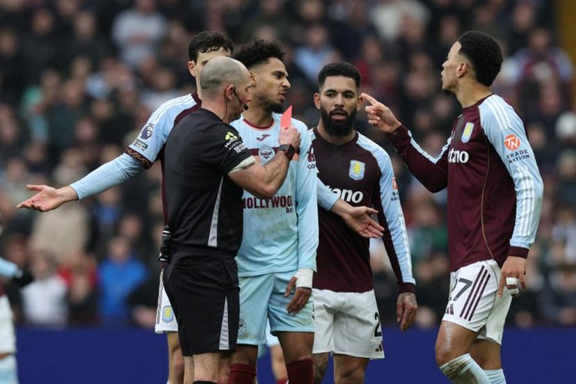 Brentford's German midfielder #07 Kevin Schade (C) is shown a red card by English referee Tim Robinson during the English Premier League football match between Aston Villa and Brentford at Villa Park in Birmingham, central England on February 1, 2026. Darren Staples / AFP