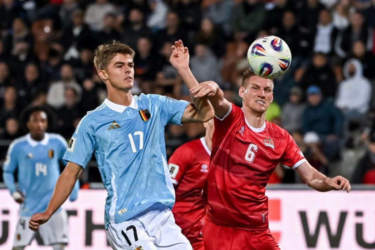 Belgium's forward #17 Charles De Ketelaere (L) and Liechtenstein's defender #06 Andreas Malin fight for the ball during the World Cup qualifiers Group J football match between Liechtenstein and Belgium at Rheinpark Stadion in Vaduz, on September 4, 2025. Fabrice COFFRINI / AFP