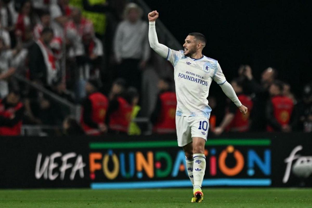 Aston Villa's Argentinian midfielder #10 Emiliano Buendia celebrates scoring the 0-2 goal during the UEFA Europa League final football match between SC Freiburg and Aston Villa at Besiktas Park in Istanbul on May 20, 2026. OZAN KOSE / AFP