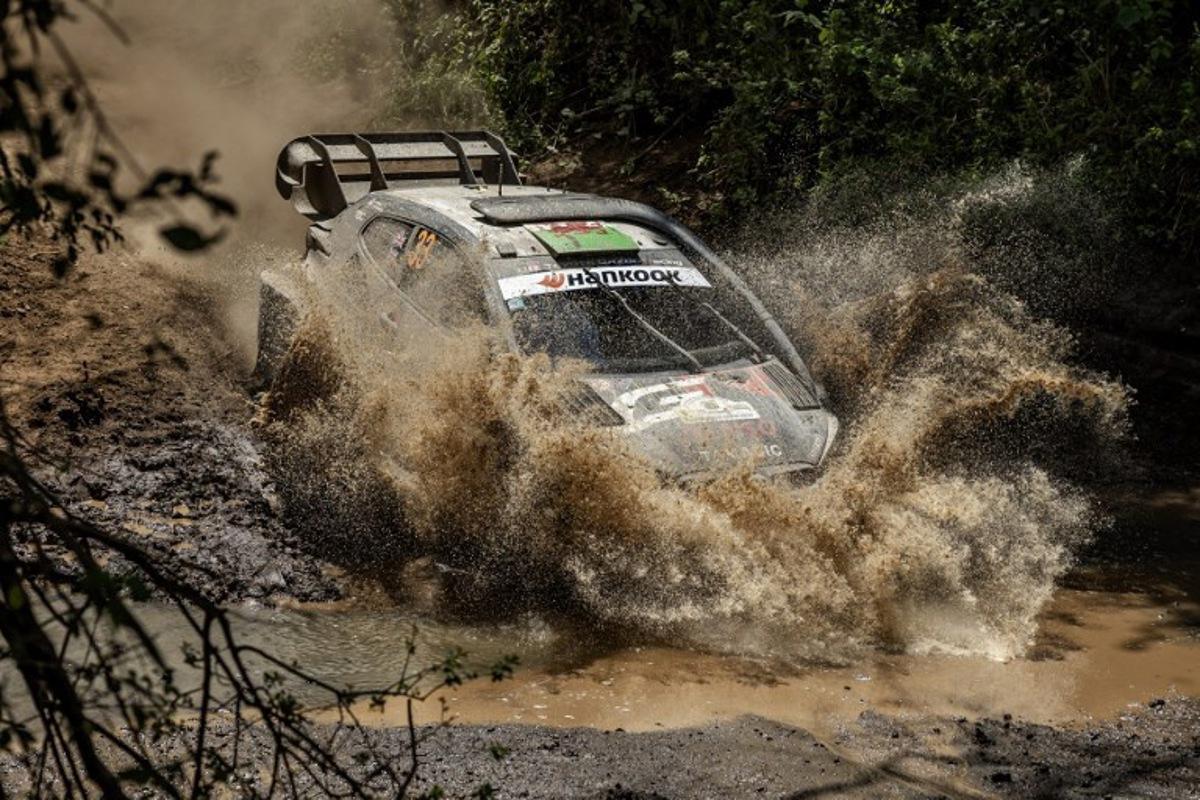 Toyota Gazoo Racing WRT's British driver Elfyn Evans steers his Toyota GR Yaris Rally1 with British co-driver Scott Martin during the World Rally Championship (WRC) Safari Rally Kenya Special Stage 13 (SS13) in Gilgil on March 22, 2025. Luis TATO / AFP