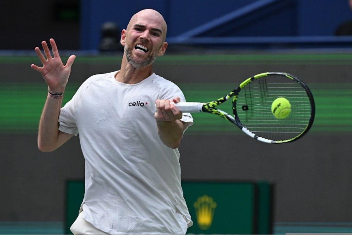 France's Adrian Mannarino hits a return to Italy's Matteo Berrettini during their men's singles match at the Shanghai Masters tennis tournament in Shanghai on October 1, 2025. Jade Gao / AFP