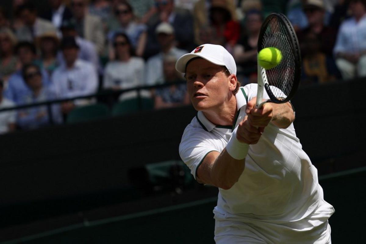 Italy's Jannik Sinner returns to US player Jenson Brooksby during their men's singles third round tennis match on the fifth day of the 2026 Wimbledon Championships at The All England Lawn Tennis and Croquet Club in Wimbledon, southwest London, on July 3, 2026. Adrian Dennis / AFP