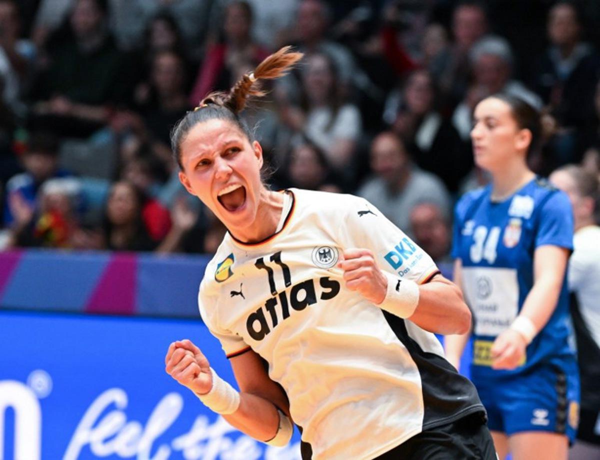 Germany's left back #11 Xenia Smits reacts after she scored during the preliminary round group C match between Germany and Serbia at the IHF Women's Handball World Championship in Stuttgart, southern Germany, on November 30, 2025. THOMAS KIENZLE / AFP