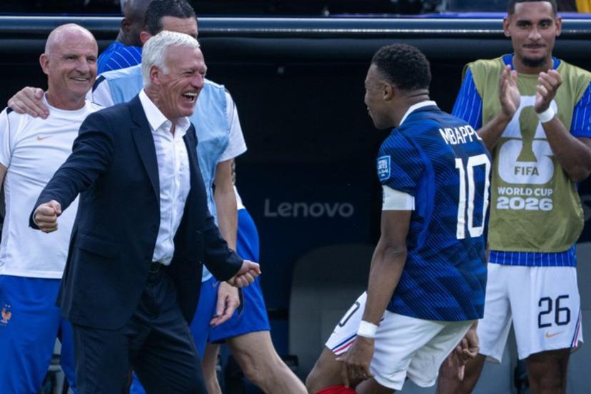 France's head coach Didier Deschamps celebrates with France's forward #10 Kylian Mbappe after he scored his team's first goal during the 2026 World Cup round of 32 football match between France and Sweden at the New York/New Jersey Stadium in East Rutherford on June 30, 2026. Pedro UGARTE / AFP