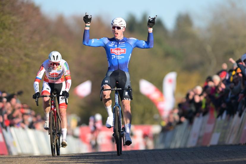 Belgian Niels Vandeputte celebrates as he crosses the finish line to win, before Belgian Michael Vanthourenhout (L) the sprint at the finish of the elite men race of the 'Waaslandcross' cyclocross cycling event, Saturday 14 February 2026 in Sint-Niklaas, the seventh and last race of the Exact Cross competition. BELGA PHOTO DAVID PINTENS