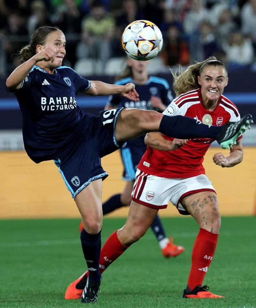 Paris FC's French defender #19 Thea Gheboval (L) and Arsenal's English midfielder #04 Georgia Stanway (r) fight for the ball during the UEFA Women's Champions League league phase Matchday 2 football match between Paris FC and Arsenal WFC at the Jean-Bouin Stadium in Paris on September 30, 2026. FRANCK FIFE / AFP