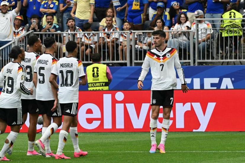 Germany's forward #07 Kai Havertz (R) celebrates with teammates after scoring a penalty kick for his team's third goal during the 2026 World Cup Group E football match between Germany and Curacao at the Houston Stadium in Houston on June 14, 2026. RONALDO SCHEMIDT / AFP