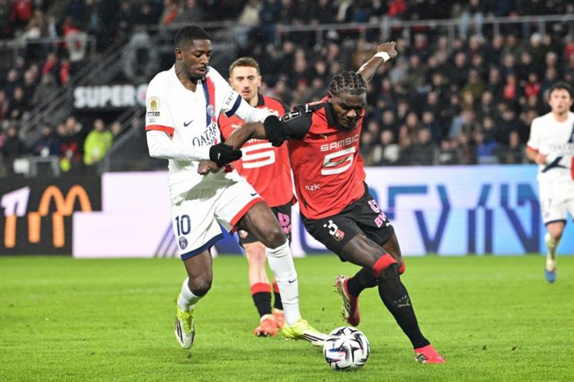 Paris Saint-Germain's French forward #10 Ousmane Dembele (L) and Rennes' French defender #03 Lilian Brassier (R) fight for the ball during the French L1 football match between Stade Rennais FC and Paris Saint-Germain (PSG) at the Roazhon Park stadium in Rennes, western France, on February 13, 2026. Damien MEYER / AFP
